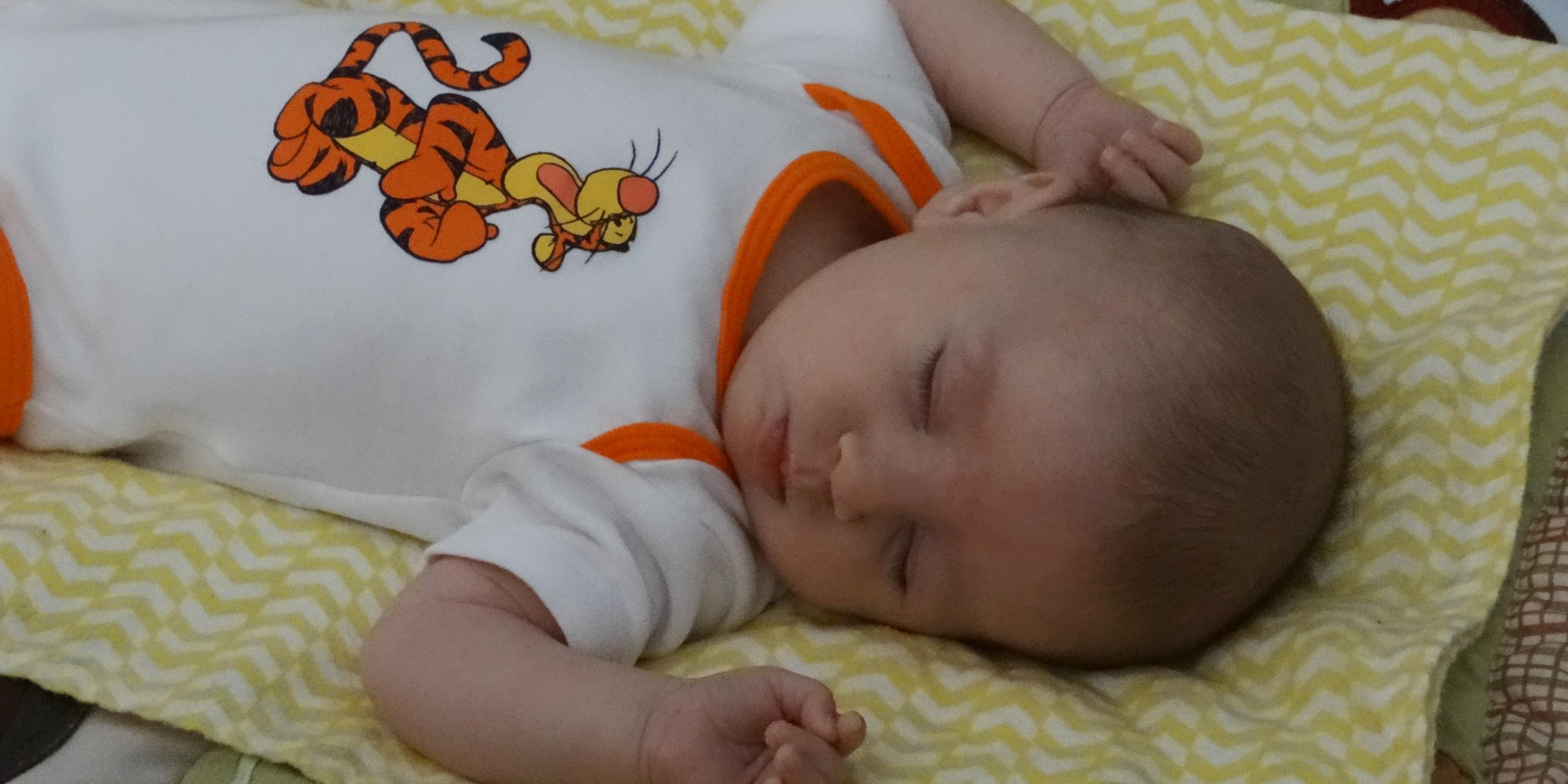 Sleeping baby in Tigger outfit