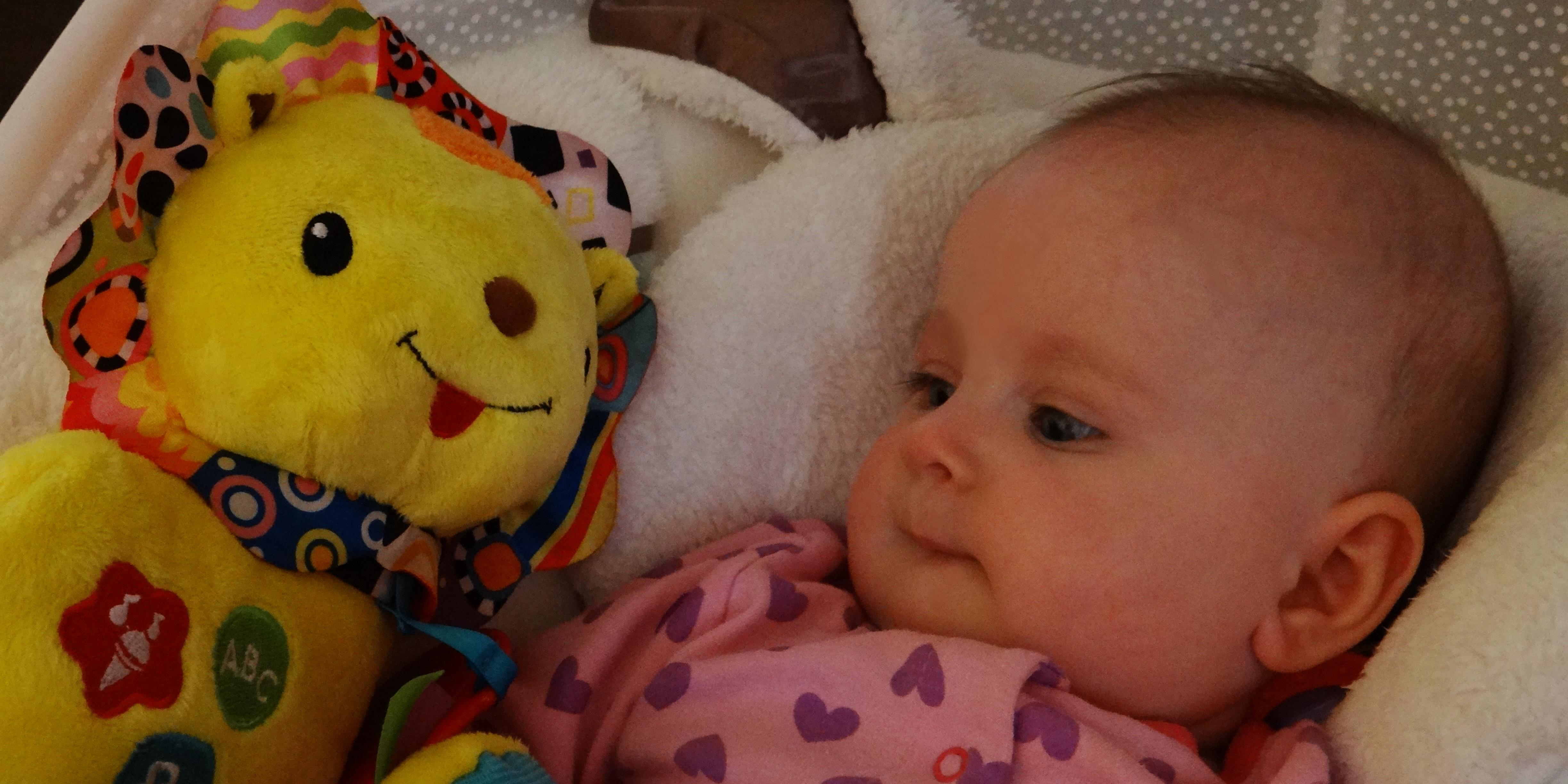 Baby girl with the Vtech Crinkle and Roar Lion