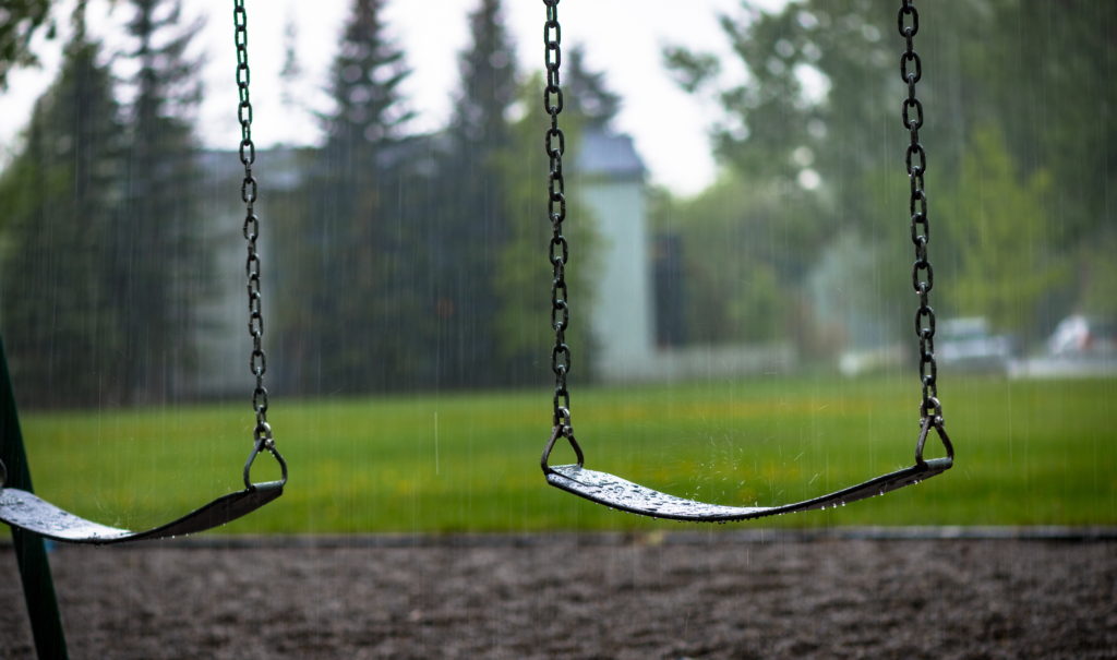 Playground swings during the rain