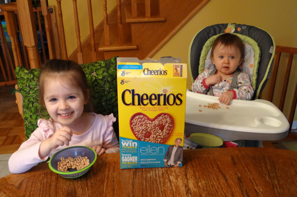 Peachy and Clementine eating Cheerios